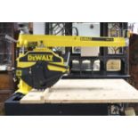 A DEWALT “DW 729” 400V RADIAL ARM SAW with three phase motor & on table stand, 48” long x 56” high