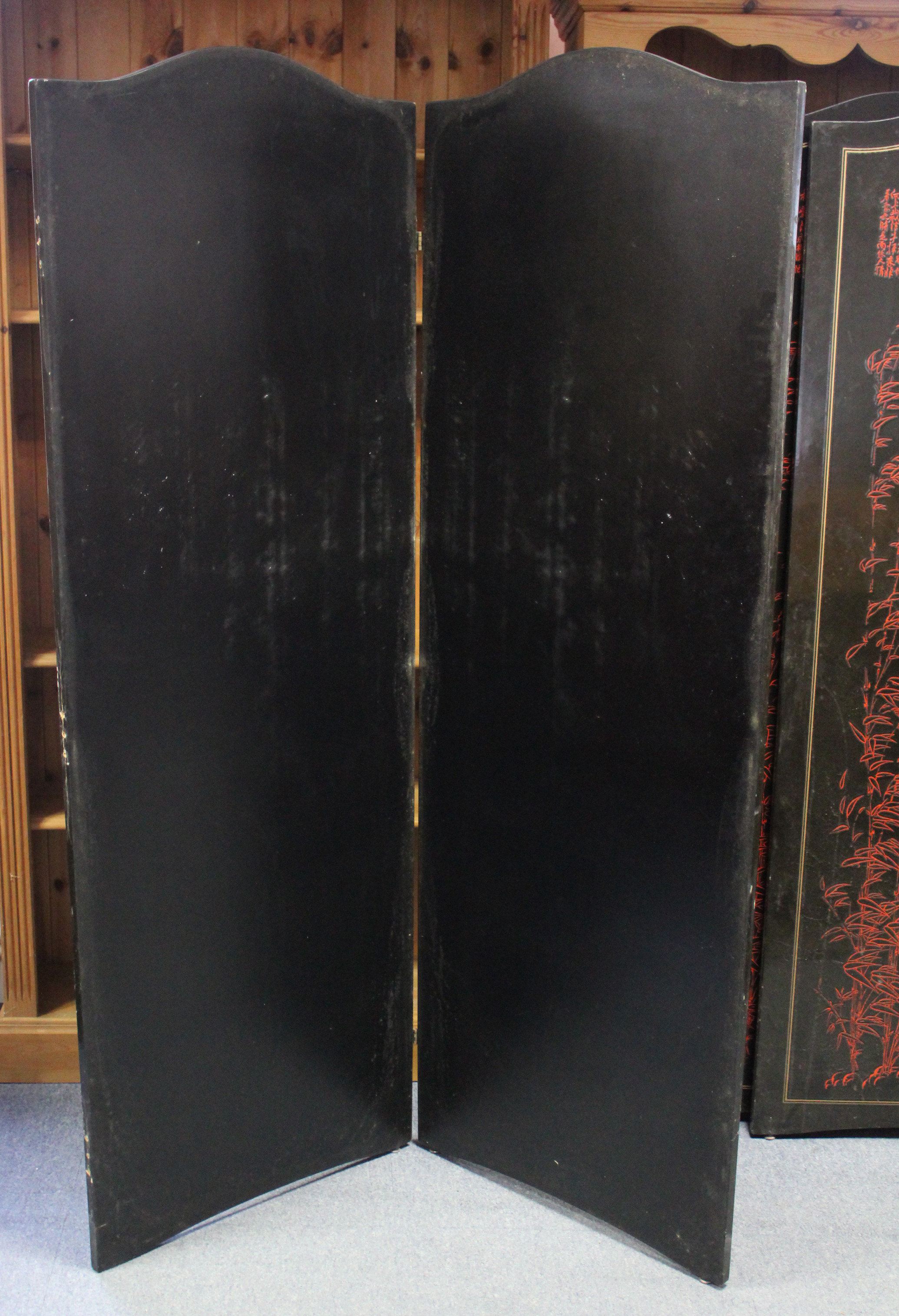 An oriental black & red lacquered four-fold draught screen, 66½” high w.a.f.; & a cloth-covered - Image 3 of 3