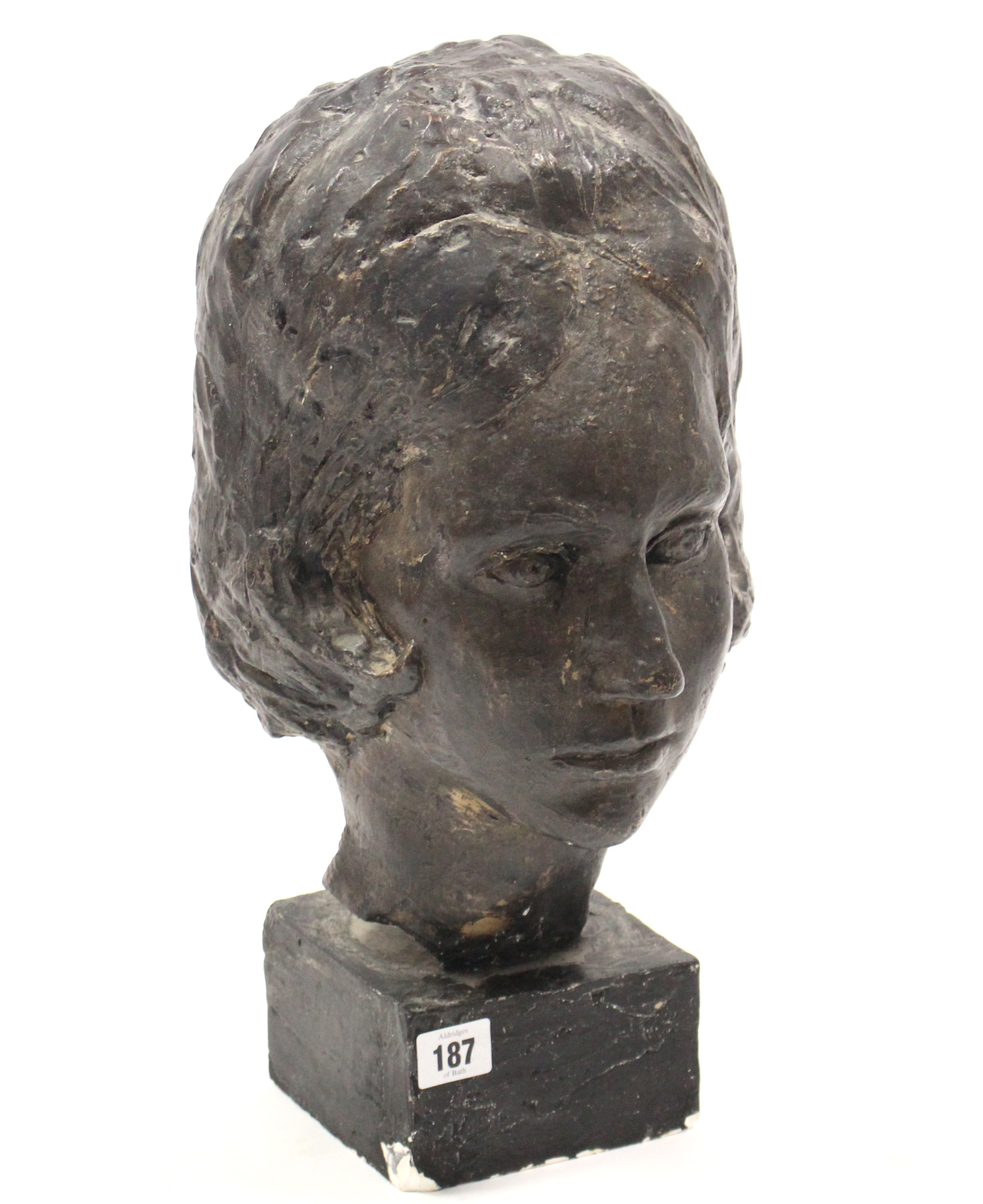 A bronzed composition female bust on square pedestal, 16” high (slight faults).