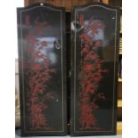 An oriental black & red lacquered four-fold draught screen, 66½” high w.a.f.; & a cloth-covered