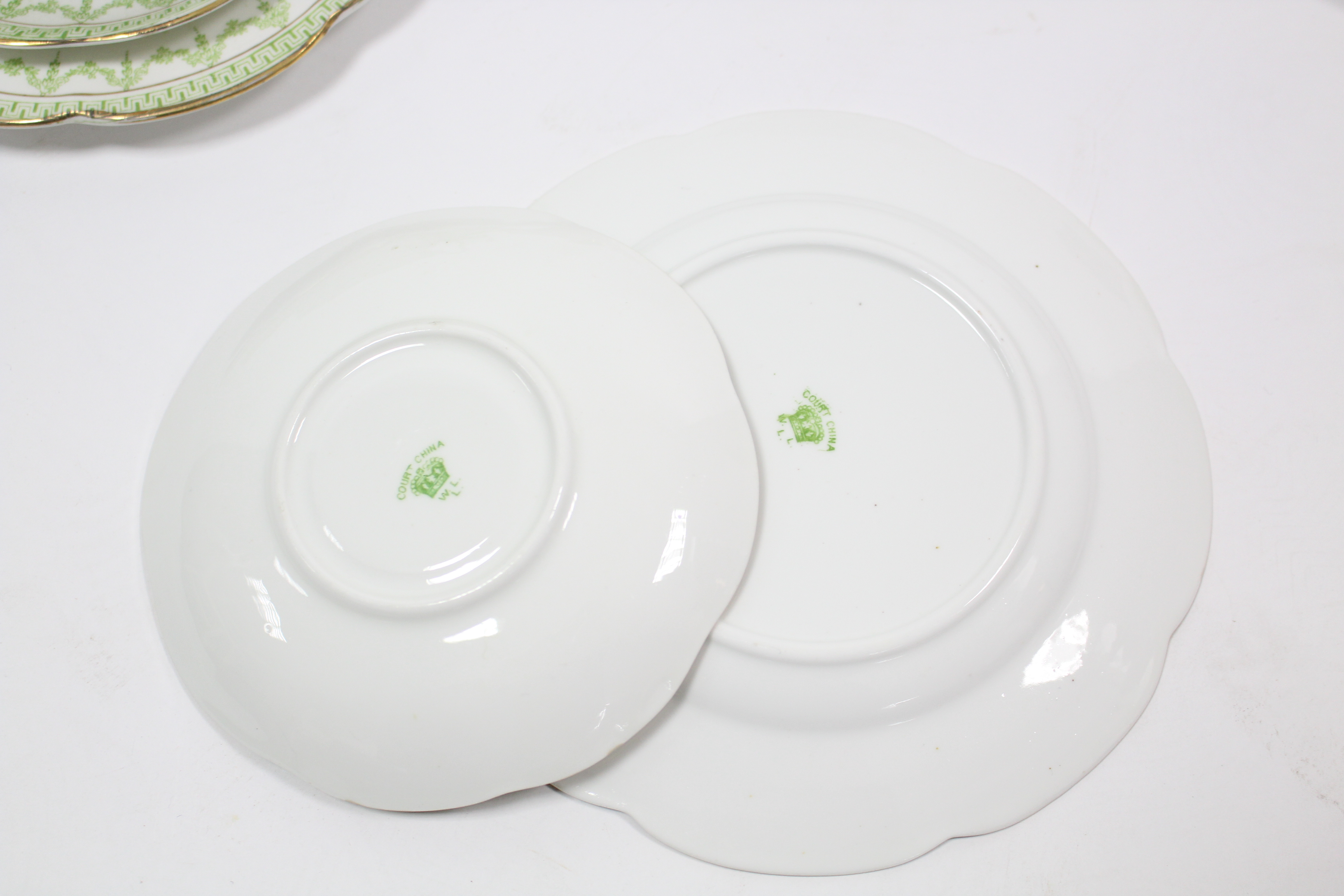 A Court china twenty-four piece part tea service of white ground & with green foliate design. - Image 2 of 2