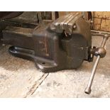 A cast-iron bench vice, 20½” long; & a pair of Slingsby aluminium sack trucks