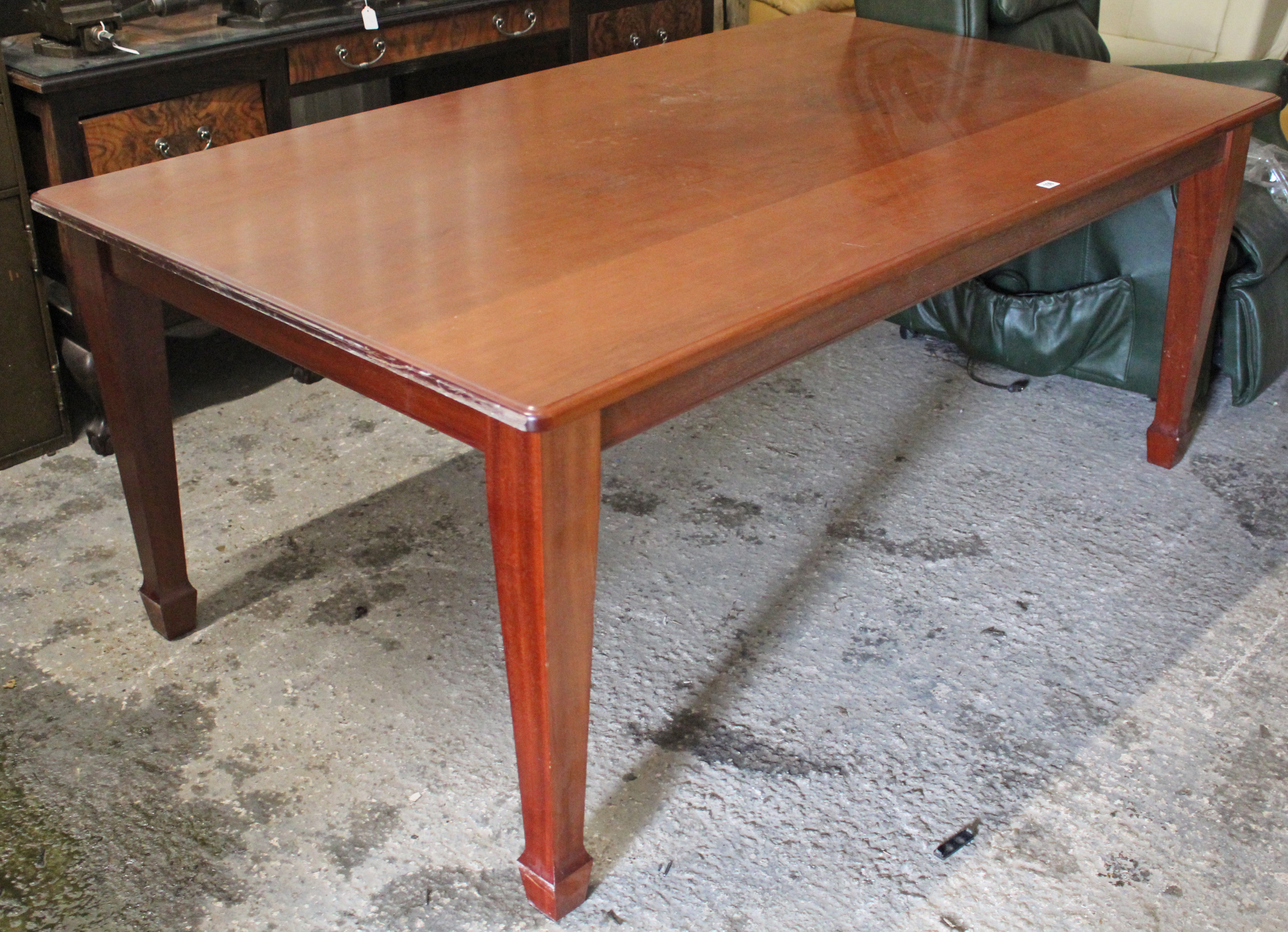 A mahogany dining table with rounded ends to the rectangular top, & on square tapered legs, 72” x