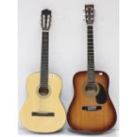 Two six-string acoustic guitars.