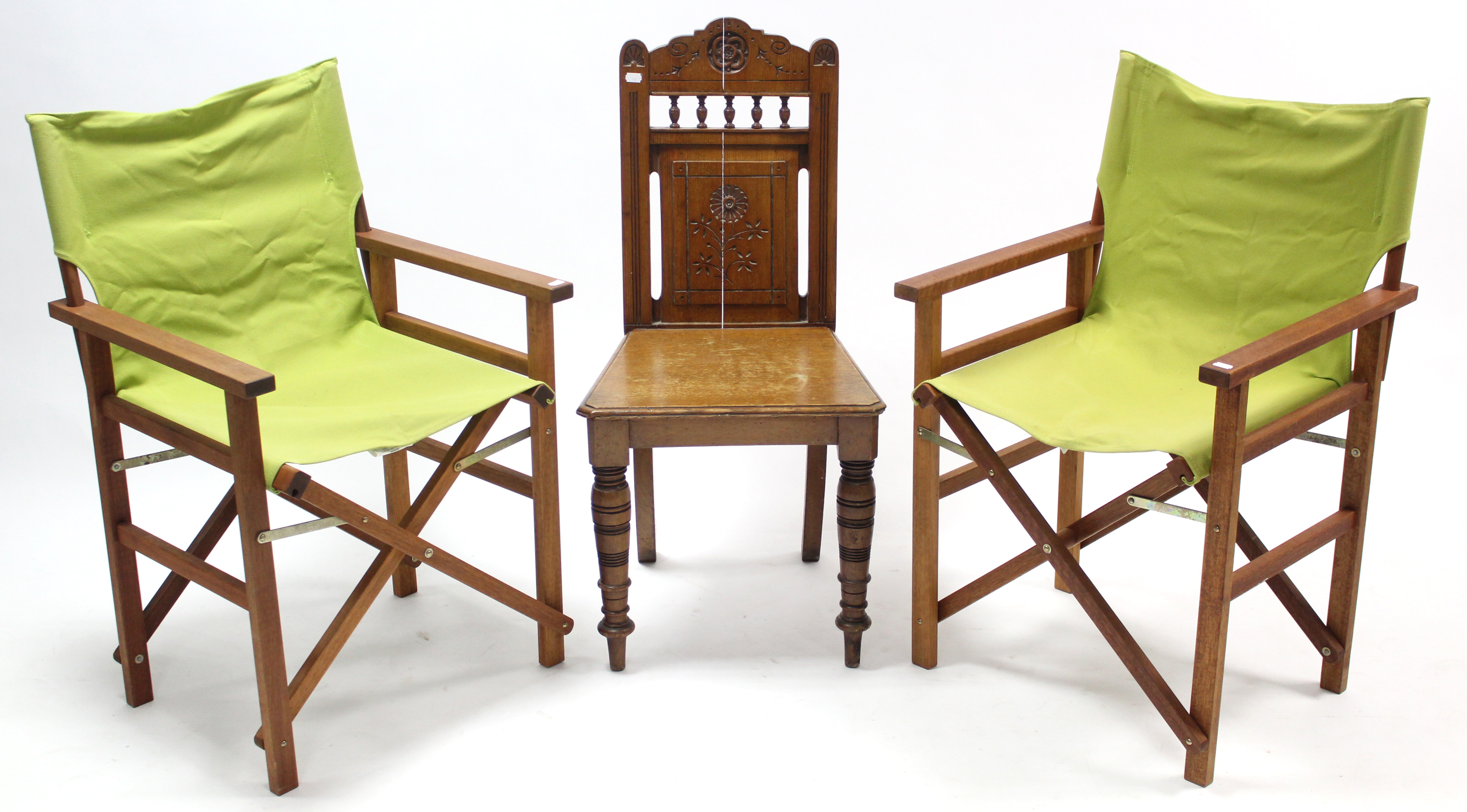 A Victorian carved oak hall chair with hard seat & on ring-turned tapered legs; together with a