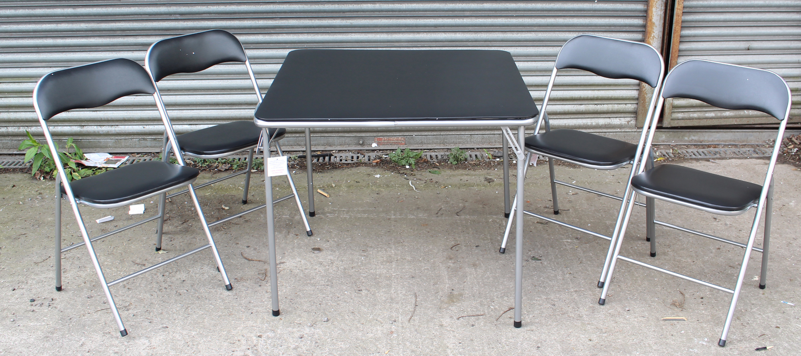 A Chinese folding dining set, boxed, as-new.