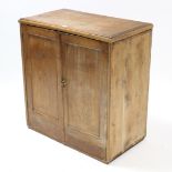 A pine dwarf cabinet fitted two shelves enclosed by pair of panel doors, 31½” wide x 33½” high.