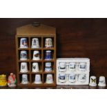 A collection of approximately one hundred & fifty various thimbles with nine display stands.