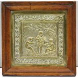 A 19th century embossed brass plaque depicting putti playing musical instruments, in maple frame,