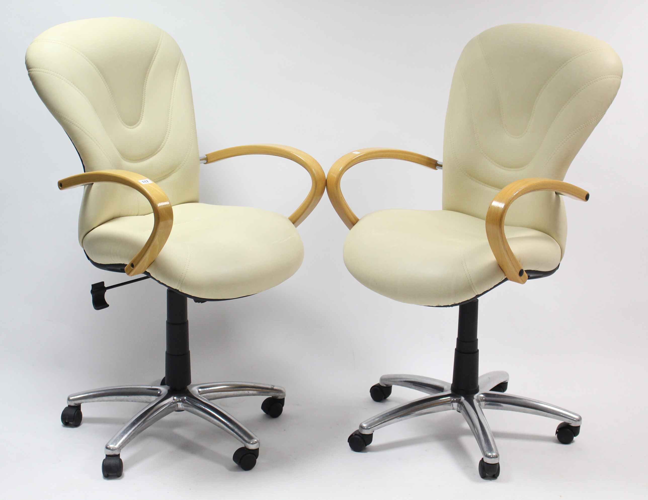 A pair of cream leatherette & chrome-finish rise-&-fall kitchen bar stools.