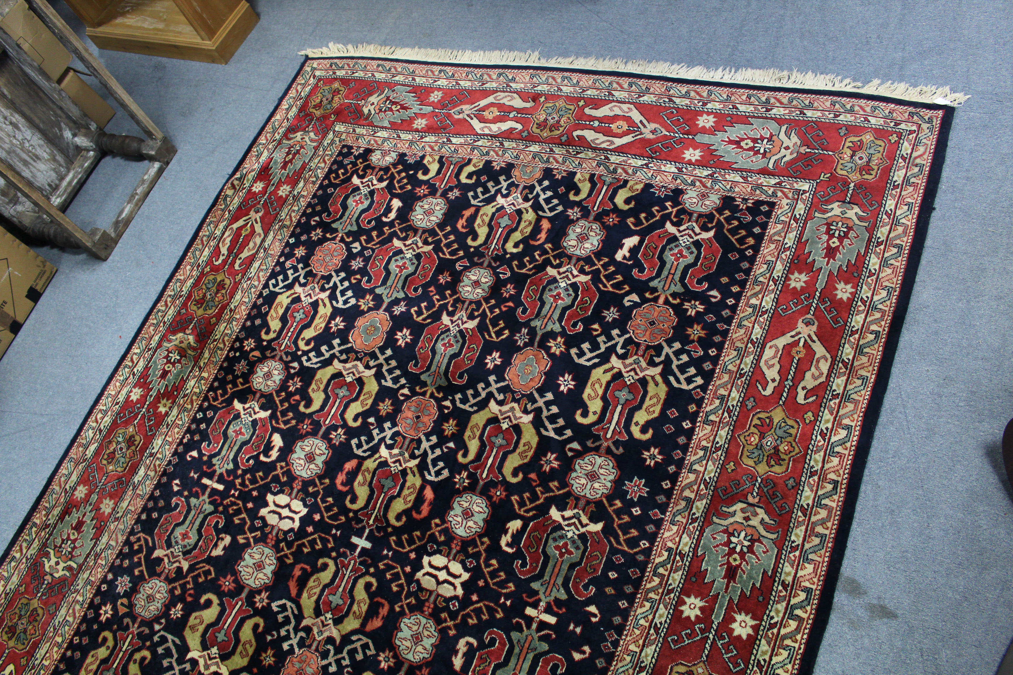 A Persian pattern carpet of crimson & ivory ground, with all-over repeating multi-coloured geometric - Image 3 of 4