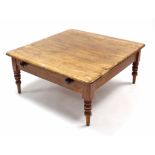 A pine square low coffee table fitted end drawer, & on four turned legs, 40½” wide x 19" high.
