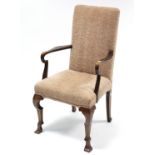A George I style walnut frame armchair with padded back & sprung seat upholstered fawn velour, &