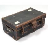 An early 20th century black fibre-covered & leather-bound travelling trunk with hinged lift-lid &
