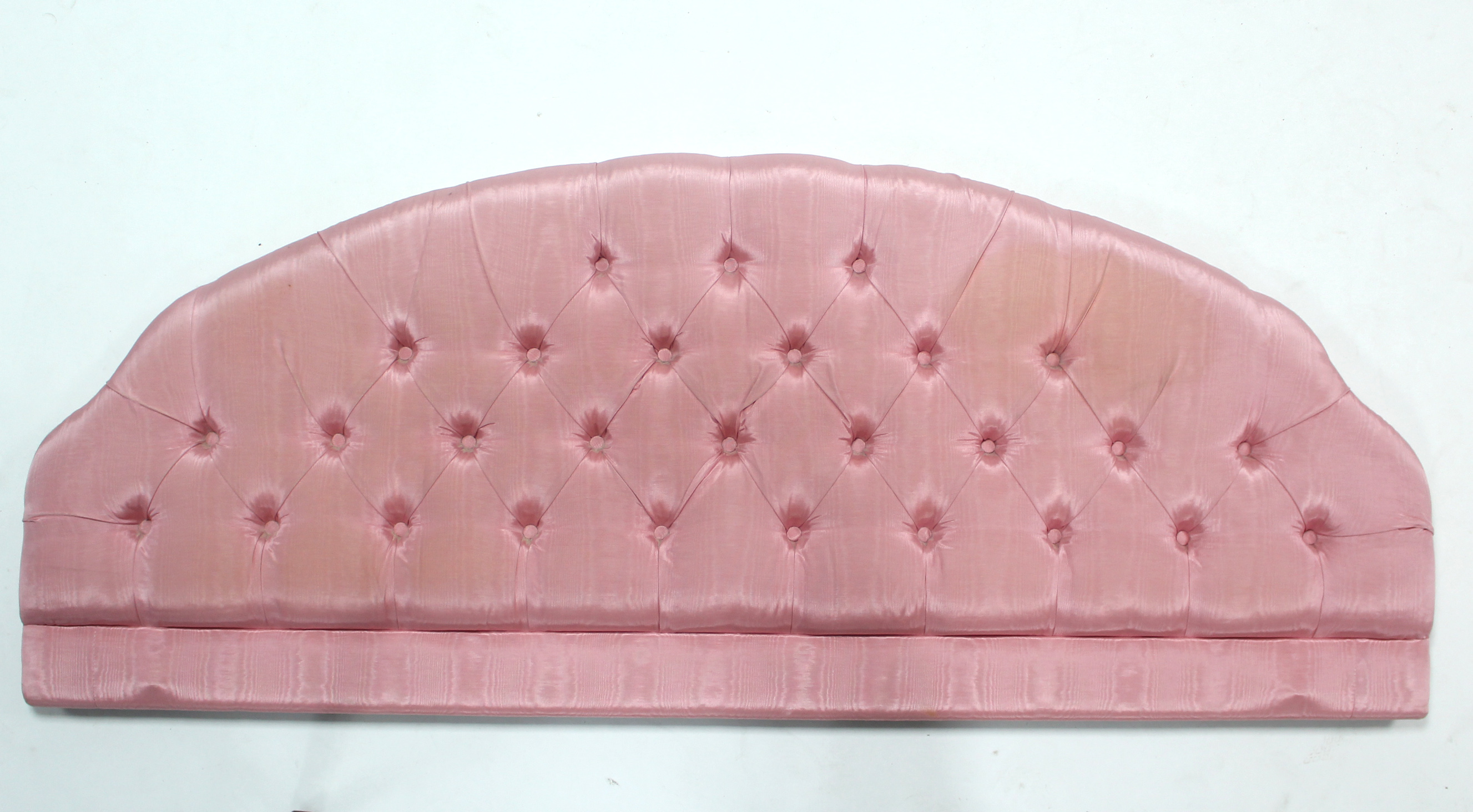 A Millbrook pink satin buttoned 5’ headboard.