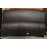 A dark brown leatherette 5’4” bedstead complete with side rails.