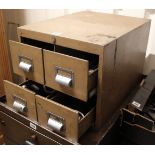 A light brown art-metal counter top chest, fitted two ranks of two short drawers, 15¾” wide x 13½”