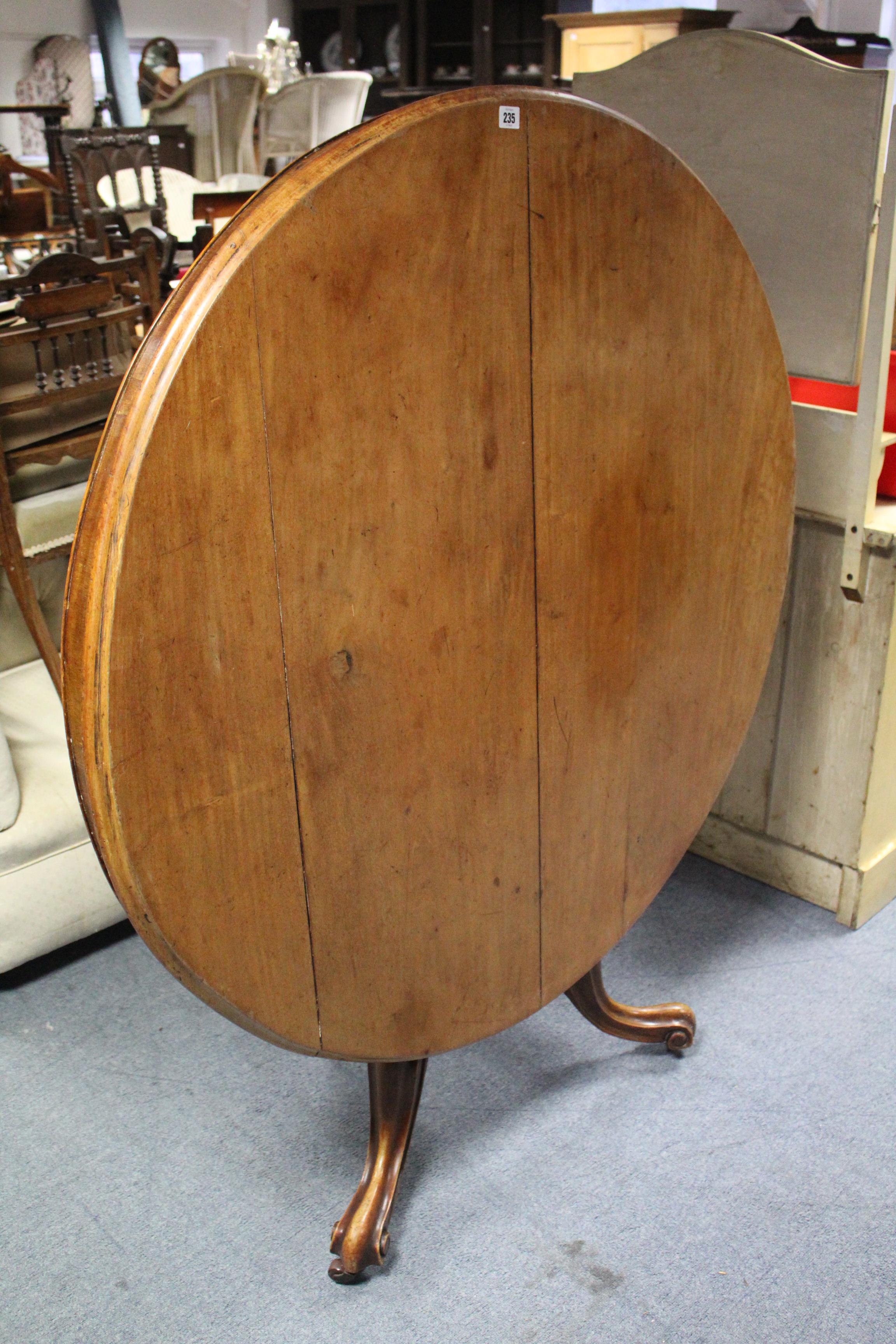 A Victorian mahogany loo table with circular tilt-top; & on vase turned centre column & three carved - Image 2 of 3