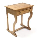 A pine child’s desk with hinged lift-lid, fitted frieze drawer, & on shaped front legs with plain
