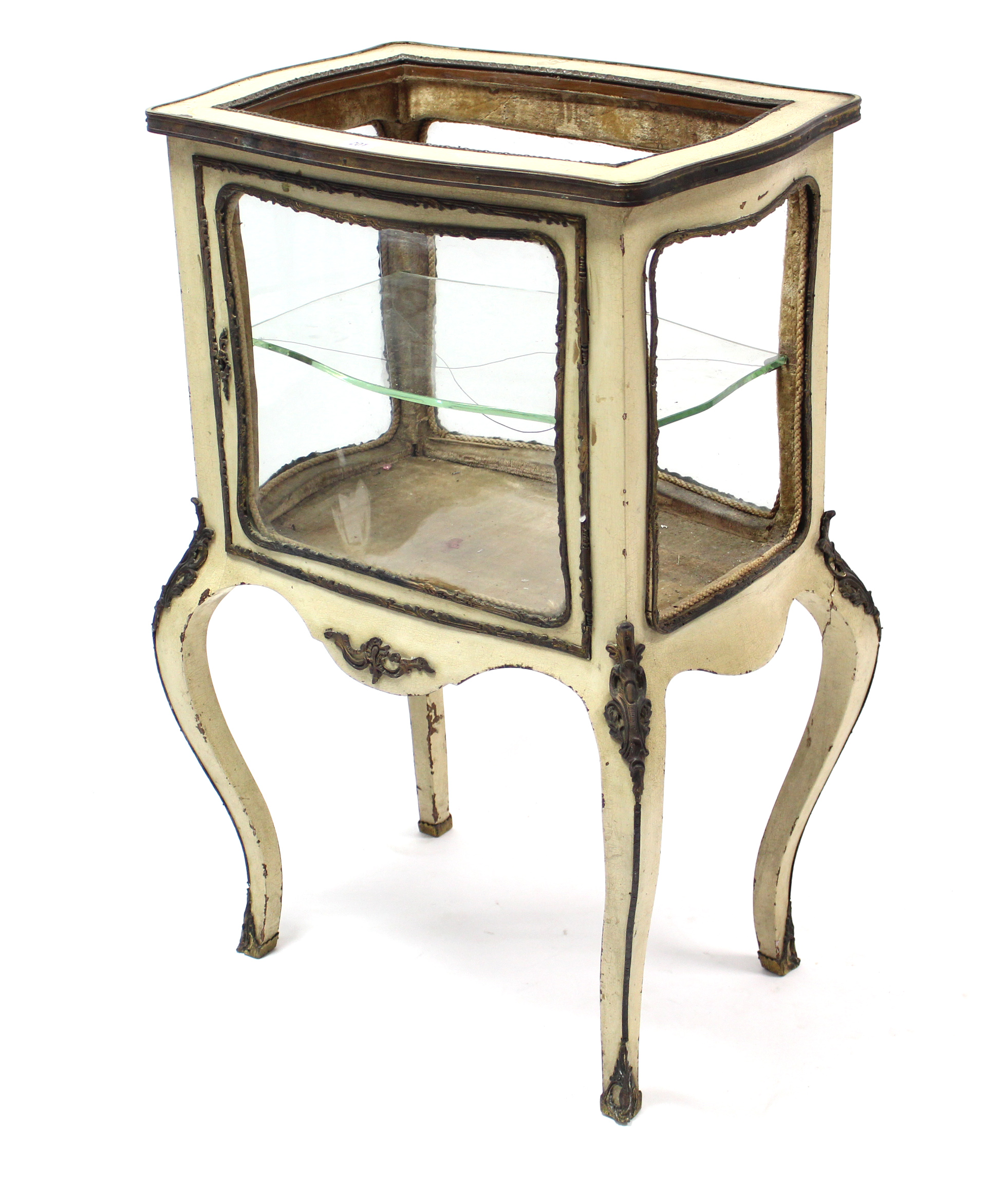 A continental cream painted wooden bijouterie table with gilt-metal mounts, enclosed by glazed door,