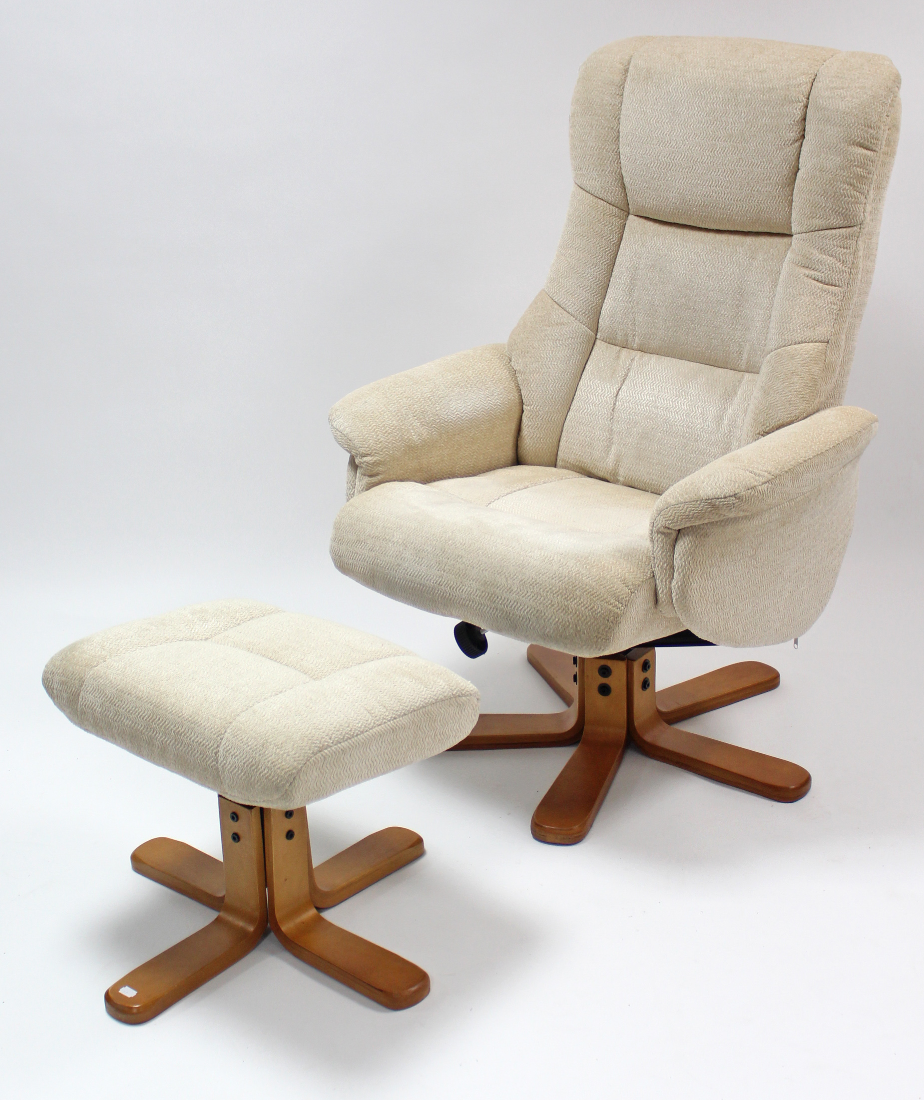 A reclining & swivel easy chair upholstered cream material; & a ditto rectangular footstool.