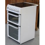 A Hotpoint “Ultima Hue 52” electric cooker in white-finish case, 19½” wide x 35½” high.