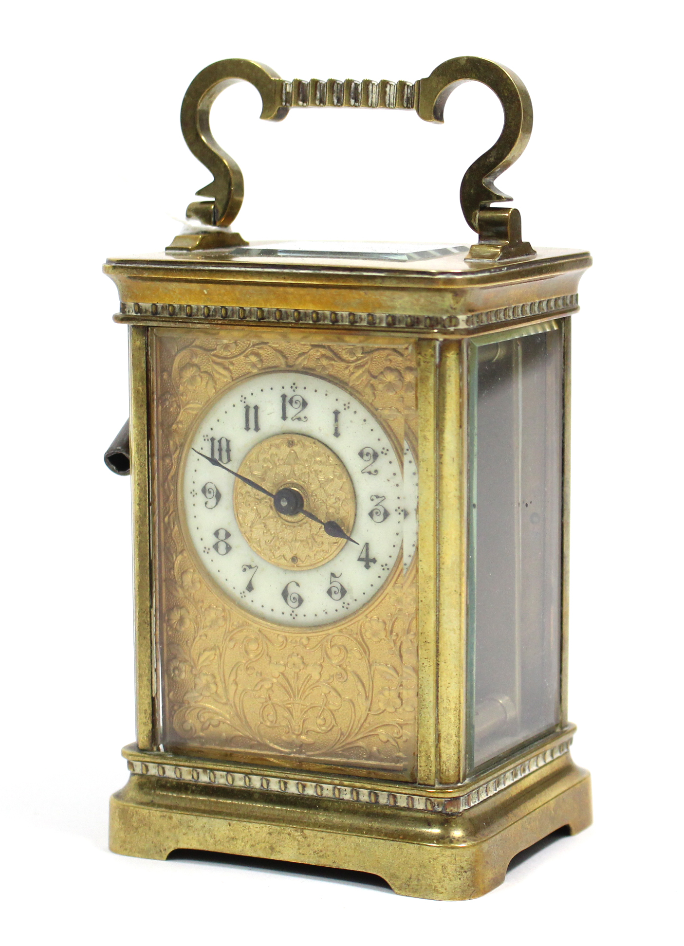 An early 20th century brass-cased carriage timepiece with white enamel & brass two-part dial, 4½”