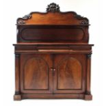 A Victorian mahogany inverted break-front chiffonier with open shelf to the shaped panel back,