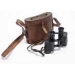 A pair of black lacquered A.M. binoculars with leather case.