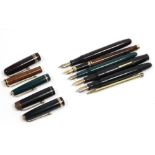 Five various fountain pens; & a propelling pencil in yellow-metal case.