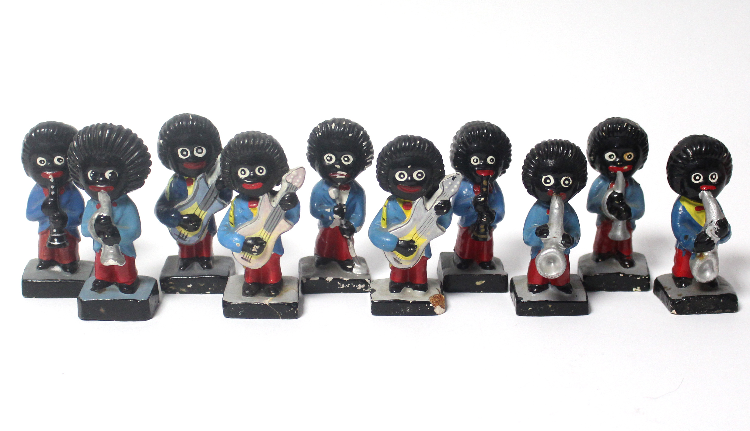 Ten Robertson’s golly bandsmen character figures.