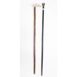 An ebonised wooden gents walking cane with silver knob handle (hallmarks rubbed); & another