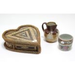 A straw-work heart-shaped trinket box, 11” wide; together with a Royal Doulton stoneware “harvest”