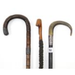 Two gent’s walking canes, each with white-metal mount; together with another walking cane; & a