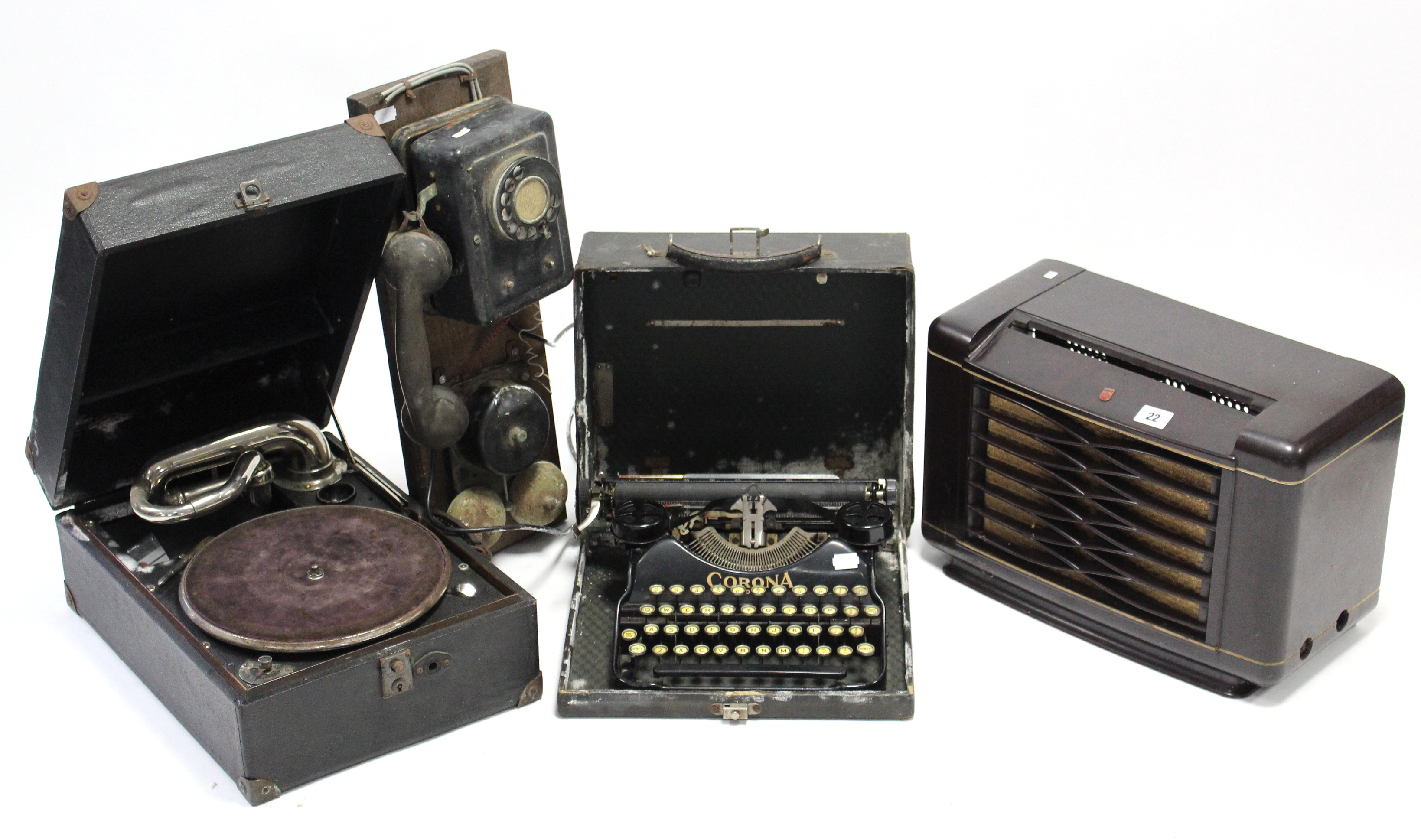 A Corona “Four” portable typewriter; a portable gramophone; a Philips valve radio in brown