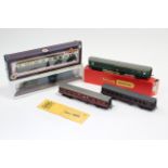 A Bachmann “00” gauge model G.W.R. coach; a Tri-ang/Hornby “H0/00” gauge model coach; a scale