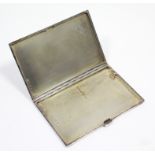 A George V silver engine-turned cigarette case, 4¾” x 3¼”, Birmingham 1930.