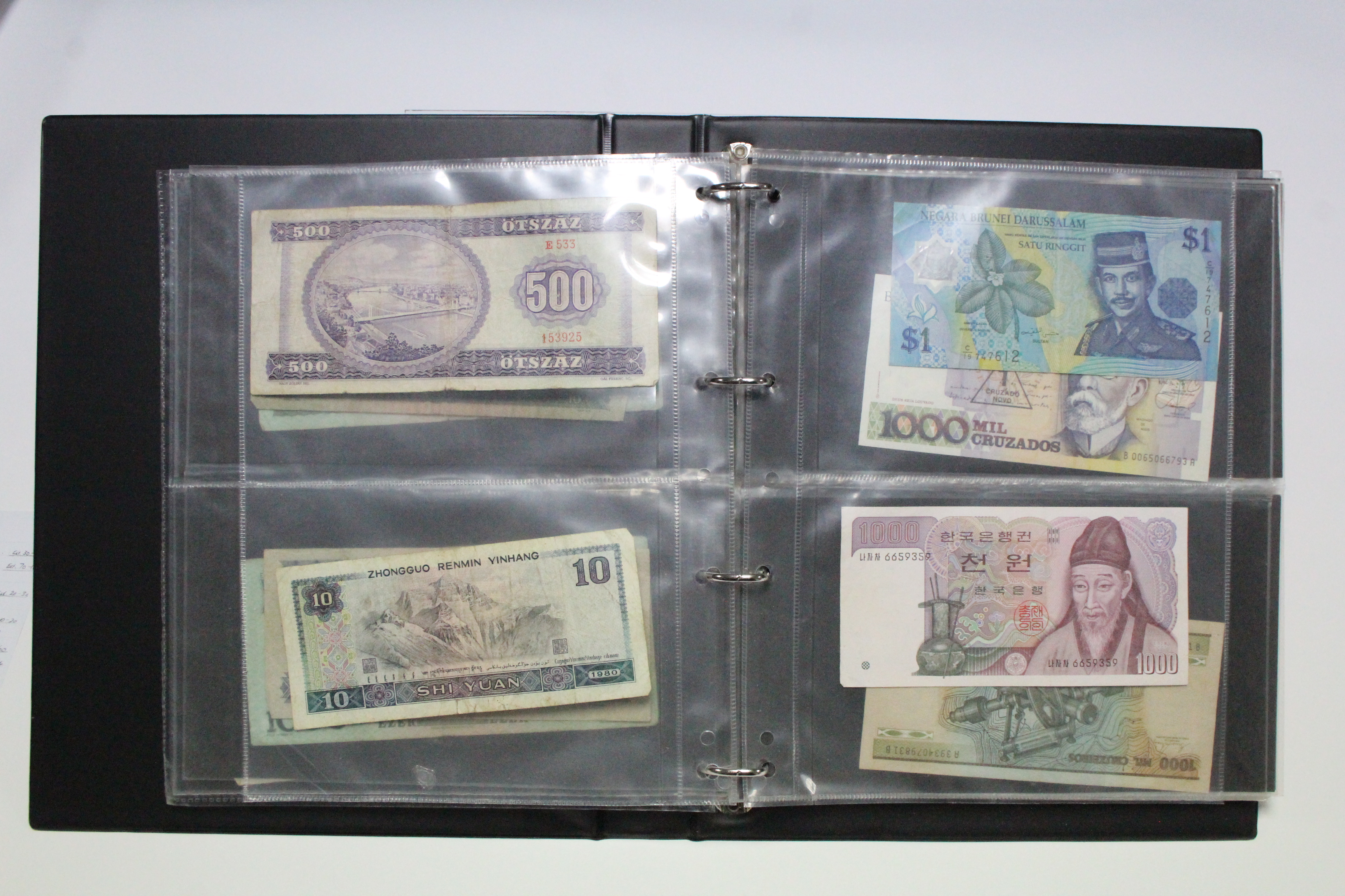 A collection of British & foreign banknotes, contained in a ring-binder album. - Image 5 of 8