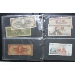 A collection of British & foreign banknotes, contained in a ring-binder album.