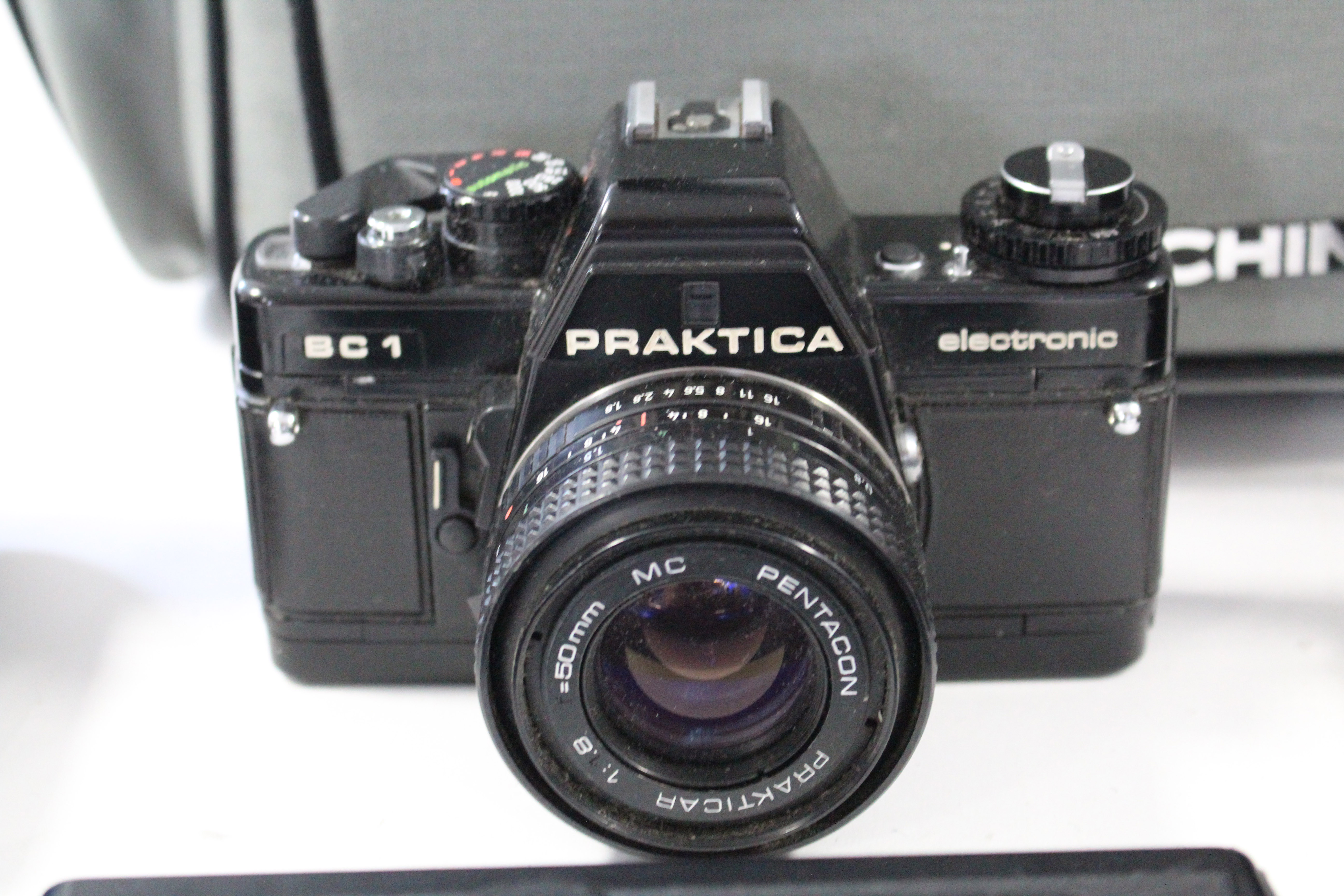 An Olympus “OM10” 50mm camera; & a Praktica “BC1” 50mm camera, each with accessories & case - Image 2 of 4