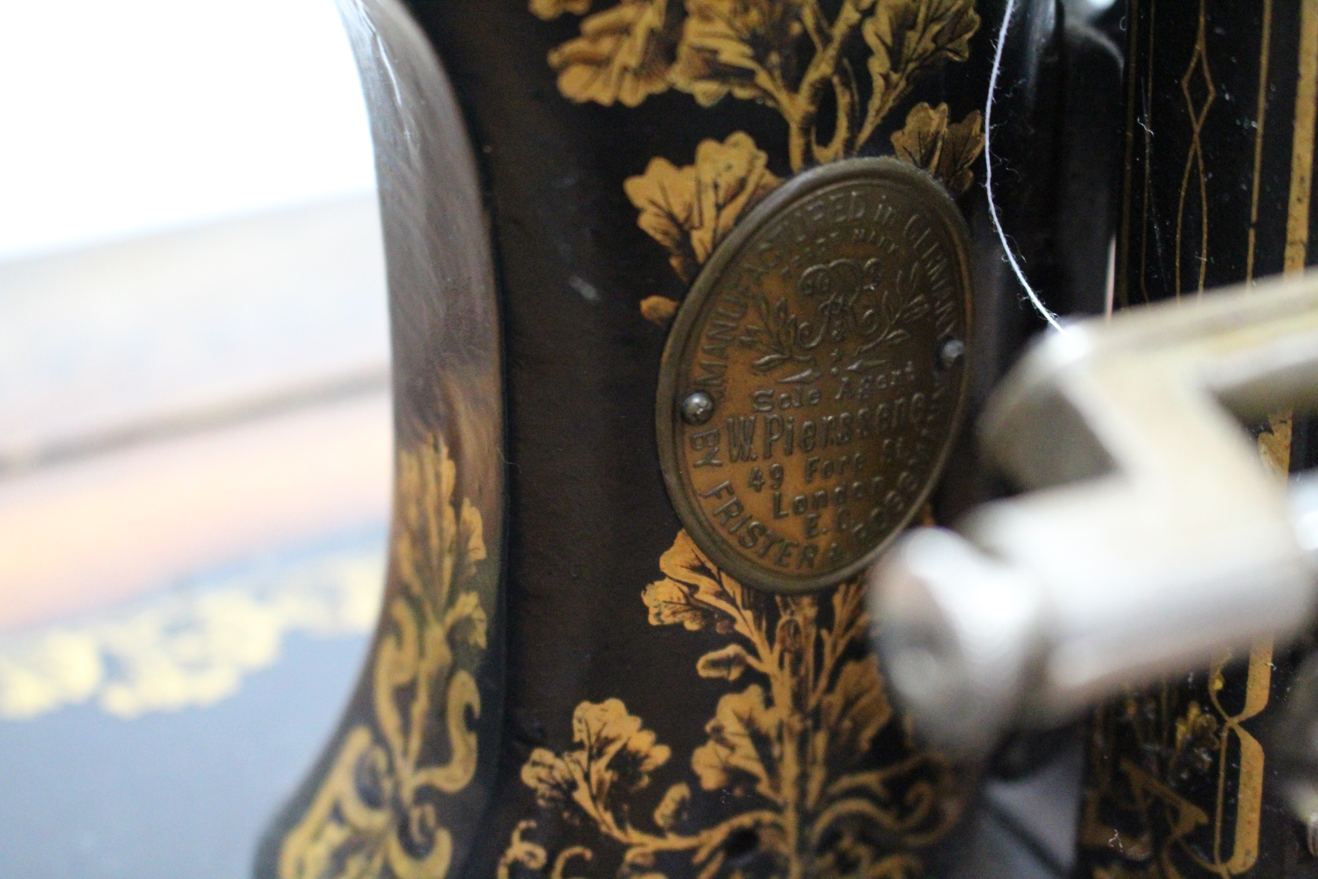 An early 20th century Frister & Rossmann treadle sewing machine in inlaid-walnut case, & on black - Image 3 of 4