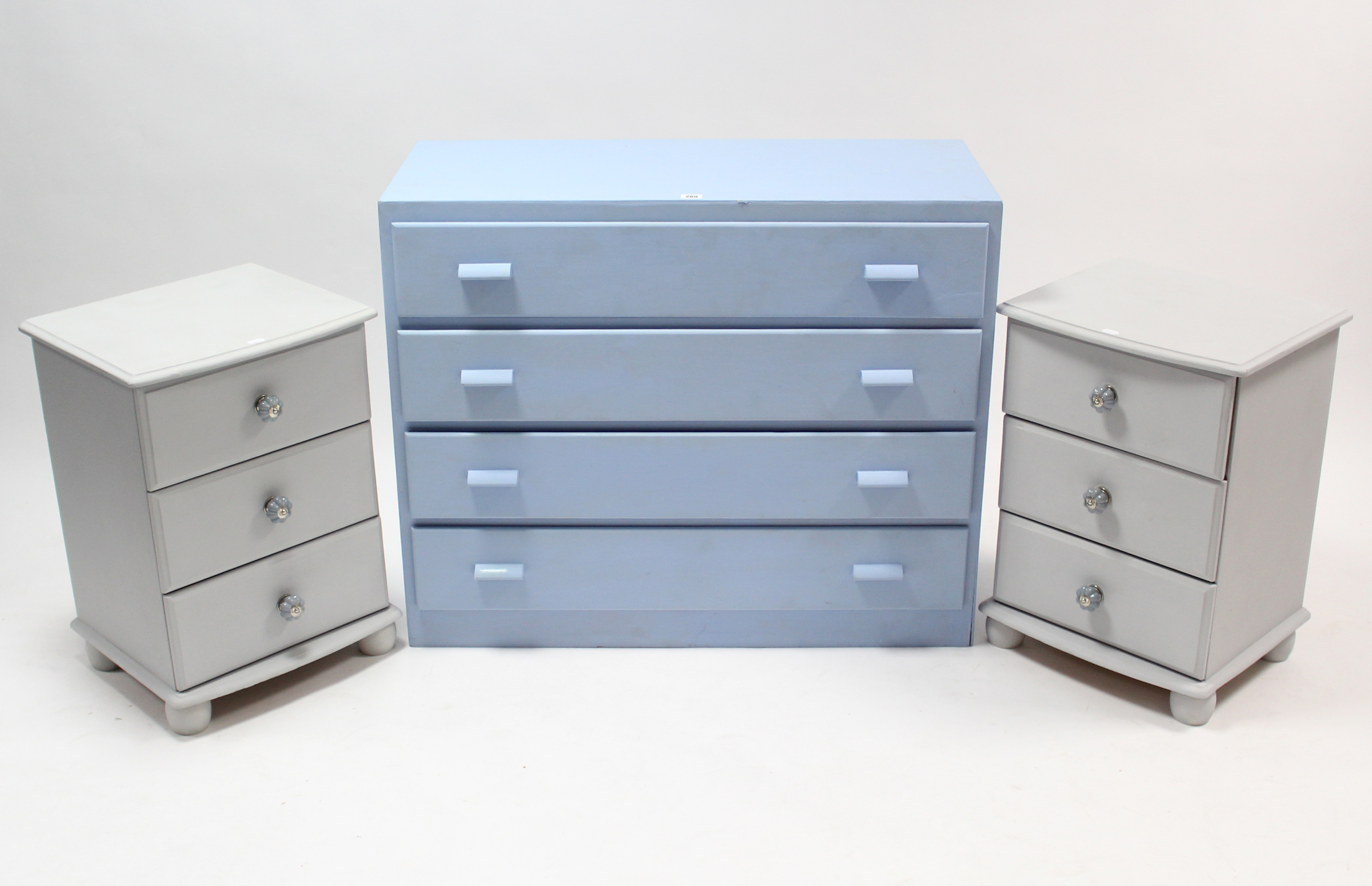 A pale blue painted wooden chest, fitted four long drawers with block handles, 36” wide x 39¼” high;