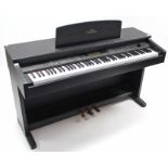 A Yamaha “Clavinova” electric piano, 54¾” long, on stand, & with stool.