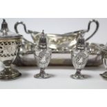 A pair of silver pepper pots, 3¾” high; & various items of platedware