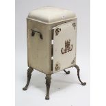 A Victorian-style white painted metal food cabinet enclosed by door, & on cast-iron cabriole legs,