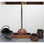 A 19th century copper engraved warming pan with long turned wood handle; a copper helmet-shaped coal