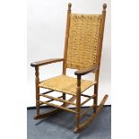 A beech & woven cane rocking chair; & a bamboo & wicker rocking chair.