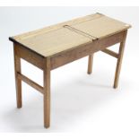 A vintage “duet” school desk, on square legs, 40¼” wide.