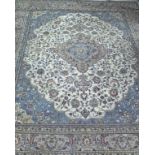 A Persian pattern carpet of ivory & pale blue ground with centre medallion & with all-over repeating