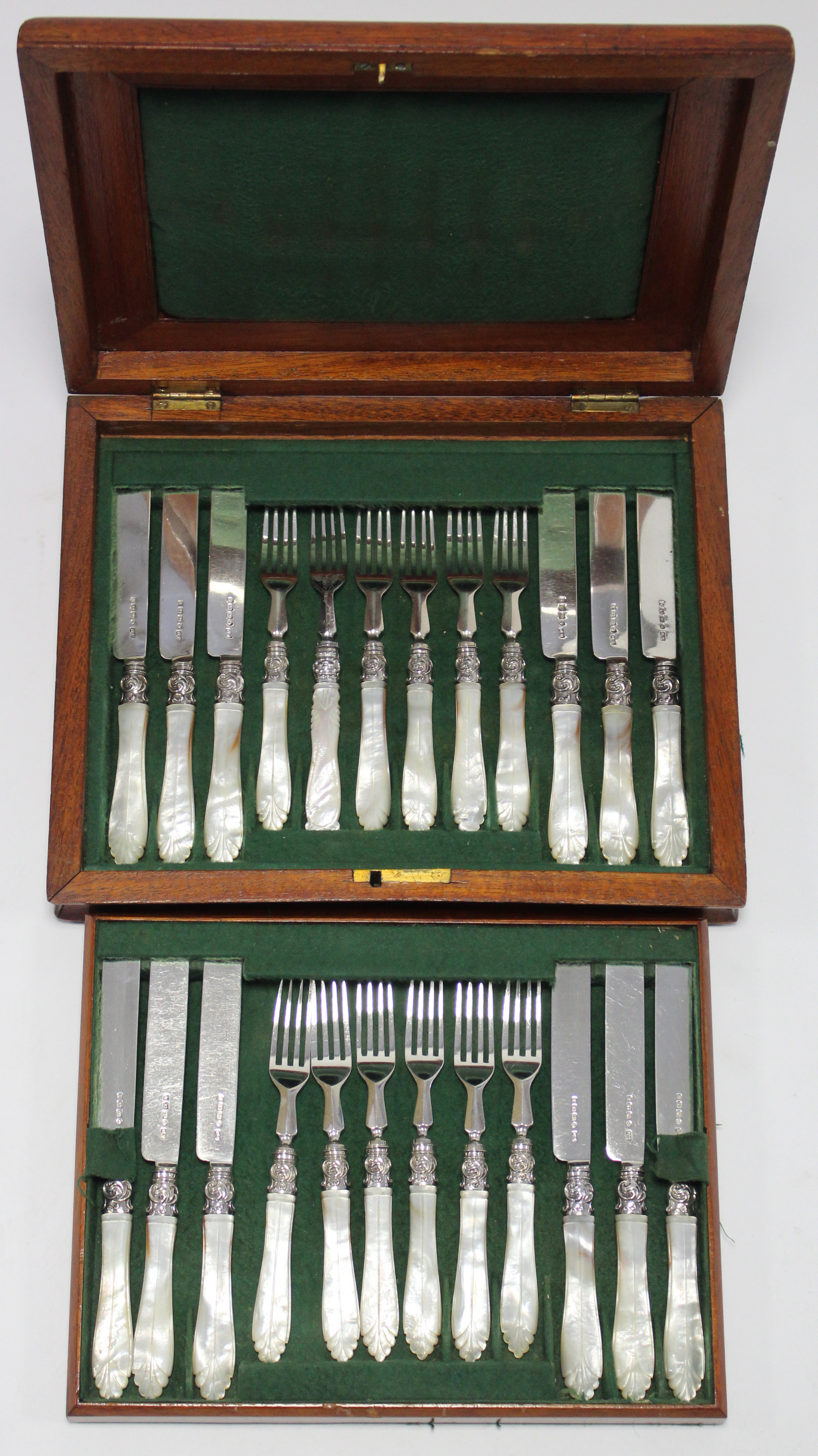 A set of twelve Victorian silver tea-knives & forks with mother-of-pearl handles, Birmingham 1873 by